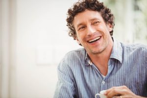 Portrait of mature man smiling at home